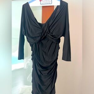 Black ruched Dolce and Gabbana dress. No size tag but fits like a size 4-6.